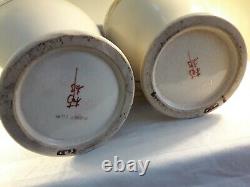 A pair of Japanese satsuma pottery vases meji period vases hand painted signed