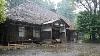 Heavy Rain On An Old Style House With A Thatched Roof